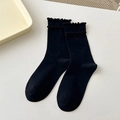 Classic black combed cotton socks featuring elegant ruffle trim and mid-tube design - Black