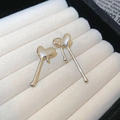 Detailed macro shot of silver heart studs with molten lava texture on white velvet display - Silver Heart Studs (S925 Silver Needle)
