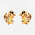 Detailed macro view of golden crocodile earrings with yellow zircon and micro-pave crystals - Rose Gold Crocodile Pair