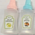 Mini portable squeeze condiment bottles with pink and blue caps for salad dressing and soy sauce - Square Bottles (Soy & Salad)