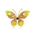 Gouden vlinderbroche met oranje kattenoogstenen en groene kristallen accenten - Geel