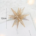 Glittering gold star Christmas tree ornament with 12cm height and shimmering finish - Bursting Star