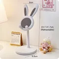 White rabbit adjustable phone stand showing height range from 22.7cm up to 31.7cm - White