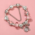 Detailed close-up of a silver charm bracelet with pink glass beads and animal pendants - Sl023318/1216-15 / 18cm