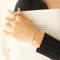 Minimalist double layer gold plated bracelet and wave pattern rings on hand - E152-Gold Bracelet 15+5cm