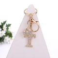 Golden metal keychain featuring a crystal-studded letter T with a crown design - Letter T / Gold
