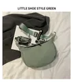 Detail of light green nylon crescent bag with adjustable strap and shoe charm accessory - Mini Shoe Charm Style / Green