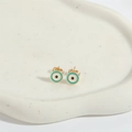 Golden Evil Eye stud earrings with blue enamel finish on white ceramic display - Devil Horn Eye - Green