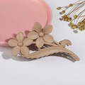 Detailed view of matte finish double flower hair claw clip on elegant textured surface - 11CM Matte Light Coffee 01 (Two Flowers)
