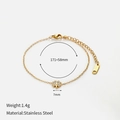 Elegant gold stainless steel bracelet featuring a 7mm four-leaf clover charm and small zircon - White Zirconia