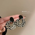 Fashionable leopard print acrylic hoop earrings with a black geometric stud on a model - 12# 925 Sterling Silver Earring Post - B&W Mosaic Round