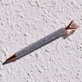 Close-up of rose gold crystal ballpoint pen with colorful rhinestones on a textured surface - White Crystal
