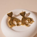 Detailed macro shot of vintage gold leopard earrings with animal totem texture - Leopard Drop Earrings (Silver Needle) / Gold