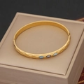 Golden stainless steel evil eye bangle featuring faceted texture on a leather box - Facet Cut Evil Eye Style (3#)