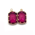 Detailed view of two faceted rectangular purple crystal pendants with elegant gold plating - 11x18mm / No. 12 (Purplish Red)