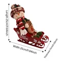 Christmas snowman figurine on red metal sleigh with Merry Christmas text 25cm size - Sledding Snowman