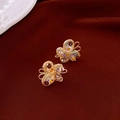 Detailed macro of golden wire butterfly earrings with purple crystals on red velvet - Gold Multi-color Butterfly (S925 Silver Pin)