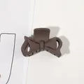 Detail of a matte dark brown bow-shaped shark hair claw clip on a minimalist surface - 4.5cm Bowknot-Dark Coffee