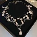 Detail of a layered butterfly necklace with waterdrop pearls and crystals on black velvet - 7# Silver Butterfly Pearl Style