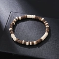 Detail of beaded wooden bracelet with brown and cream cylindrical beads on black gift box - ZJ11931-Brown and Beige Two-Tone Retro Wood Bracelet