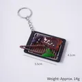 Mini-Grill Schlüsselanhänger mit Aal und Aubergine, Gewicht 14g, 5,5cm x 4,1cm - Kotelett Grillplatte - Mit Schlüsselring
