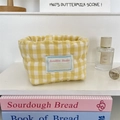 Close-up of yellow checkered quilted storage basket with heart patterns and soft fabric texture - Quilted Heart Yellow Gingham (1cm)