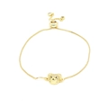 Gold-toned adjustable bolo bracelet featuring a pavé zircon bear head on white background - White