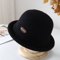 Detail of black wool cloche hat with Brunt embroidery on a wooden display stand - Black
