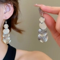 Detail of silver brushed metal multi-disc drop earrings worn by a model in soft light - 17# Silver Multi-disc Frosted Long Style (Earring Hook)