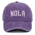 Detailed close-up of white NOLA embroidery on purple washed cotton baseball cap - Adjustable / Purple