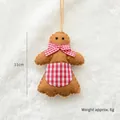 Gingerbread man felt ornament with red bow tie and white stitch details, height 11cm - Apron Gingerbread Man