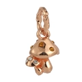 Macro detail of rose gold mushroom pendant with amber gemstones on a white background - Mushroom Style