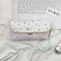 Detail of pink quilted floral pencil case with mint wrist strap and pompom trim - Pink Floral + Pink Stripes