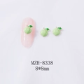 Detail view of 8x8mm peach alloy nail charms in green with gold plating and leaf detail - Light Green Peach (Gold Base) (8338)