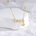 Elegante goldene LOVE Halskette mit Herzanhänger und Zirkon auf weißem Stein - LOVE Herz Zirkonia / Gold