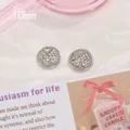 Round silver metal pendant with 10mm bow knot design and white sparkling rhinestones - Bow Tag with Rhinestone 1pc