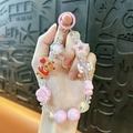 Adorable pink Capybara beaded phone strap featuring star and flower charms for keys - Capybara Beaded Charm / Random Hand-painted Beads / Pink