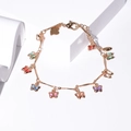 Elegant gold butterfly bracelet with colorful crystal pendants on a white background - Colorful Butterfly Gold