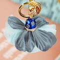 Exquisite blue and grey floral butterfly keychain with shiny crystals and soft fabric petals - Deep Blue Clover Flower