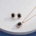 Detailed close-up of golden jewelry set with black oval stones and zircon accents - Gold Oval Black (HQ0001(10))