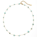 Detail of gold stainless steel necklace with turquoise gravel stone and lobster clasp - Light Blue