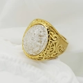 Macro detail of vintage gold ring featuring a white cracked stone and ornate engravings - US 7 / Gold + White Stone