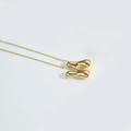 Minimalist gold puffed letter H pendant necklace with elegant shiny metallic finish - Letter N