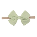 Detail of light green bow baby headband with jacquard texture and high-stretch nude band - Light Green