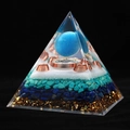 Macro shot of 8cm crystal pyramid with lapis lazuli, turquoise, and copper coil layers - 10cm / Blue Cat's Eye