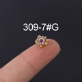 Miniature gold ear stud with purple gemstone and white zircon accents held on a fingertip - Zirconia Mini Stud Earrings Style (309-7#G) / Gold
