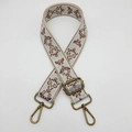 Close-up of wide embroidered beige and brown bag strap with adjustable metal buckle - Beige Coffee Bronze Hook