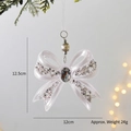 White acrylic Christmas bow pendant with silver glitter and center gemstone detail - White Bowknot