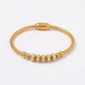 Bracciale a catena serpente in acciaio al titanio dorato con cinque ciondoli in cristallo - Bracciale Rigido Oro (Z240)