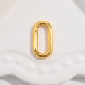 Close-up of golden oval spring clasp connector for jewelry making on a white tray - Type C: Gold Oval